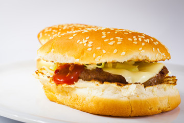 Delicious juicy cheeseburger with tomato and lettuce