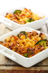 Baked pasta with cheese in a porcelain bowl.