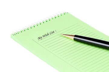 Wish list with pen over a white background