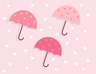 Three pink colored umbrellas floating
