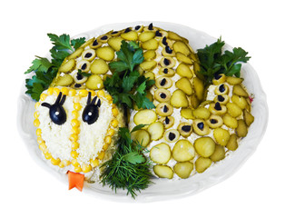 salad vegetables laid out in the form of a snake