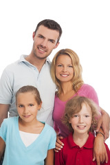 portrait of young family of four people standing together