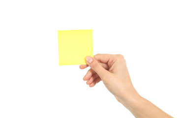 Woman hand holding a yellow notepaper