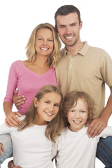 happy caucasian family standing together and smiling happily