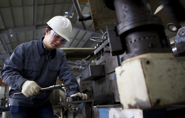 mechanical technician measuring detail