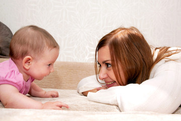 Obraz na płótnie Canvas Mother and baby talking