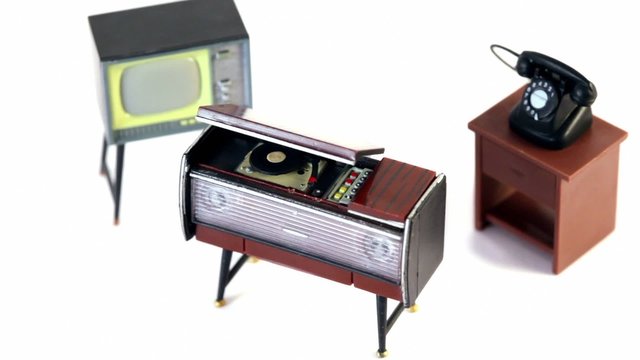 Toy vintage phonograph, phone and tv set spins