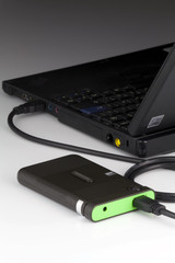 The external hard drive connected to the laptop