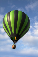 Hot air balloon rising in the sky