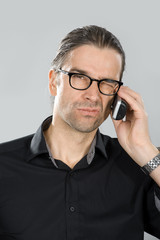 man is skeptical on the phone