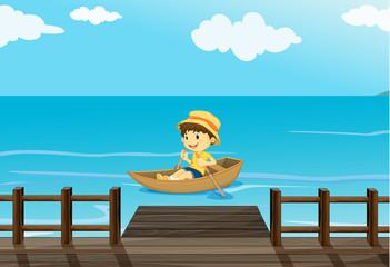 A boy riding a boat