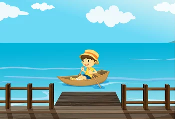 Stof per meter Een jongen die op een boot rijdt © GraphicsRF