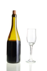 Red wine bottle with empty glass