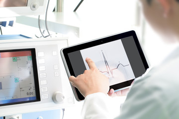 Doctor at work with a digital tablet