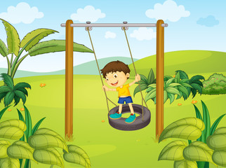 A little boy swinging