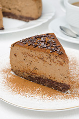 piece of chocolate cheesecake on a plate closeup vertical