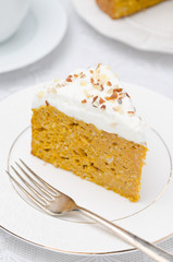 piece of pumpkin cake with cream closeup