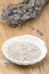 sea salt with lavender in a white bowl, vertical