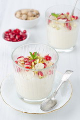 semolina dessert with pomegranate seeds and pistachios portions