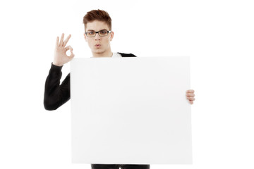 Young man with a blank baner