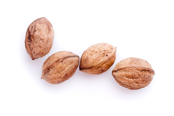 Four walnuts - on a white background