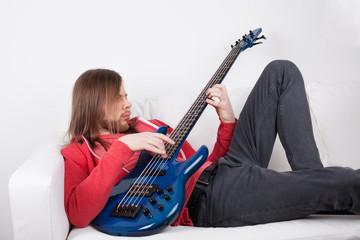 Fototapeta premium young guy playing guitar