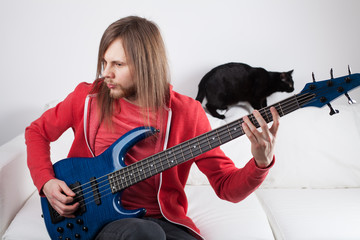 Fototapeta premium young guy playing guitar