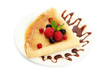 Delicious pancakes with berries,chocolate and honey