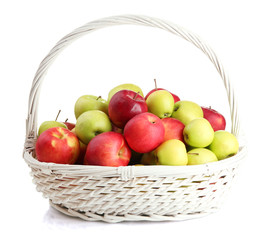 juicy apples in basket, isolated on white