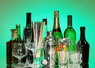 Collection of various glasses and drinks on color background