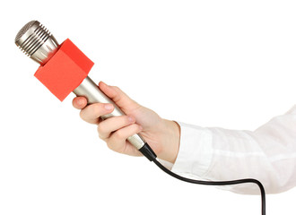 Female hand with microphone isolated on white