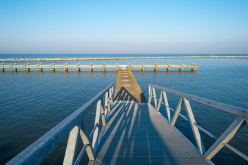 Jetty covered in snow in winter