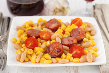 sausages with beans and corn in tomato sauce