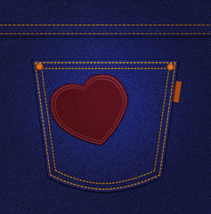 Red heart on jeans pocket on blue denim background