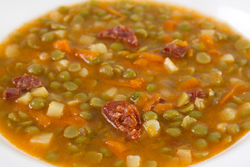 pea soup with chorizo and vegetables
