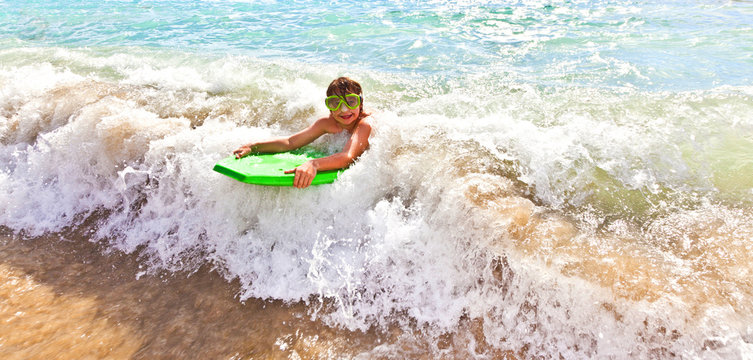 boy has fun with the surfboard