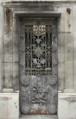 Ornate tomb door in the Pere Lachaise cemetery, Paris