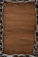 metal chain on wood