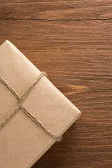 parcel wrapped packaged box on wood