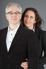 Happy middle aged couple. Man and woman. Studio shot.