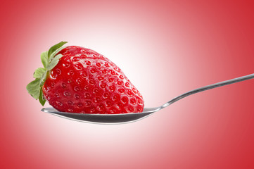 Strawberry in a  spoon