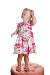 Little girl looking up in surprise, it is isolated on white