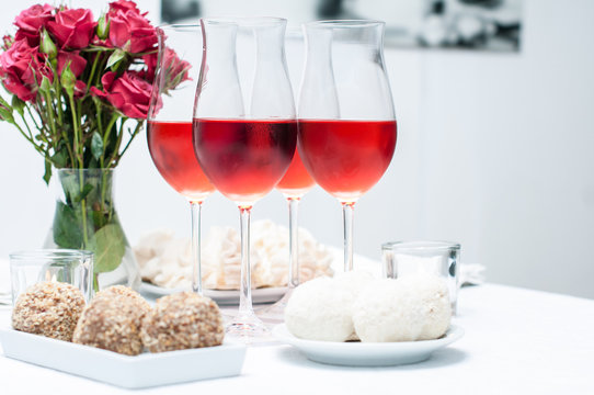 Rose wine in glasses, home party