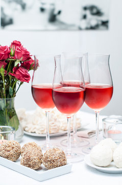 Rose wine in glasses, home party