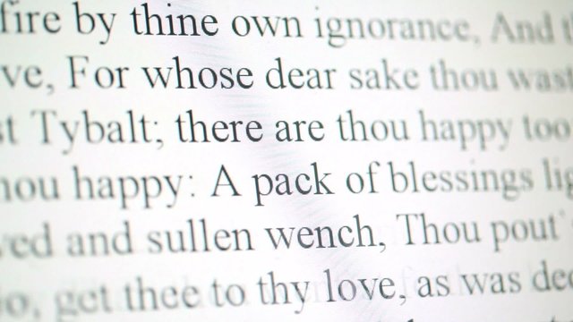 Black text moves upward on white screen