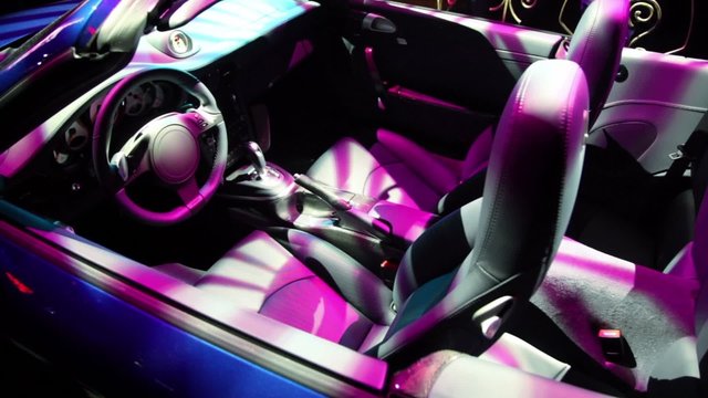 Automobile cabin in colorful illumination