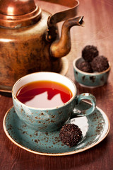Tea and chocolate candies in a vintage style