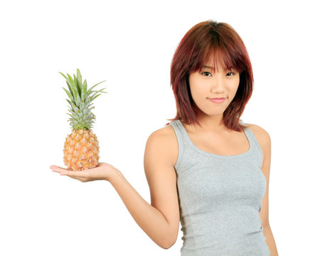 Isolated young asian woman with pineapple