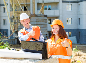 success female and male construction workers