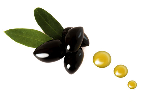Several black olives with oil drops